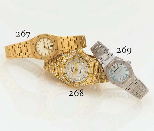 BREITLING. A FINE LIMITED EDITION LADY'S 18K GOLD AND DIAMOND WRISTWATCH WITH CENTER SECONDS, DATE AND BRACELET