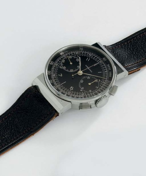 Longines. A very fine and unusual stainless steel chronograph wristwatch with hooded lugs and black dial
