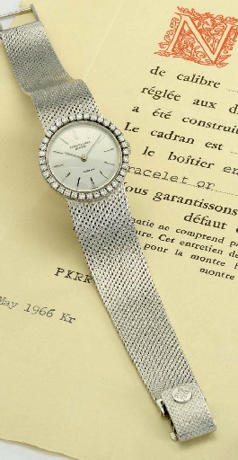 Patek Philippe. A ladies 18K white gold and diamond-set wristwatch with bracelet, original certificate and retailer's invoice
