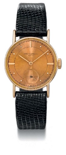 Patek Philippe. A fine and rare 18K pink gold wristwatch with pink dial