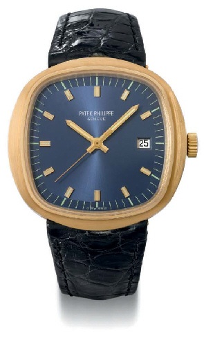Patek Philippe. An oversized 18K gold cushion-shaped electronic wristwatch with sweep centre seconds and date