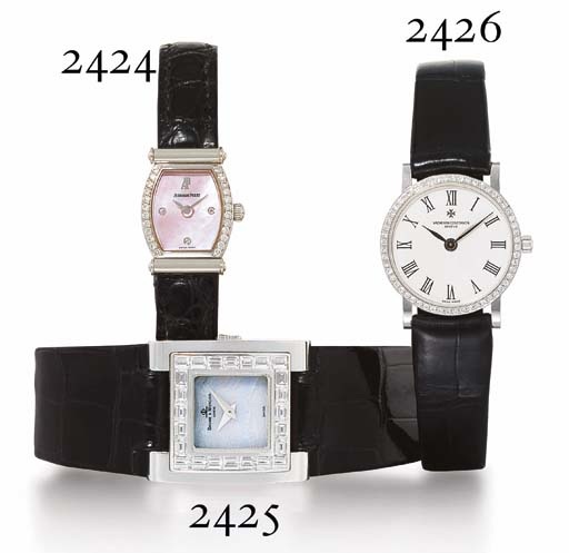 AUDEMARS PIGUET. A LADY'S 18K WHITE GOLD AND DIAMOND-SET TONNEAU-SHAPED WRISTWATCH WITH MOTHER-OF-PEARL DIAL