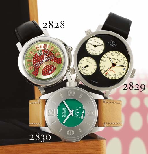 GERALD GENTA. AN OVERSIZED STAINLESS STEEL AUTOMATIC DOUBLE RETROGRADE JUMP HOUR WRISTWATCH WITH DATE