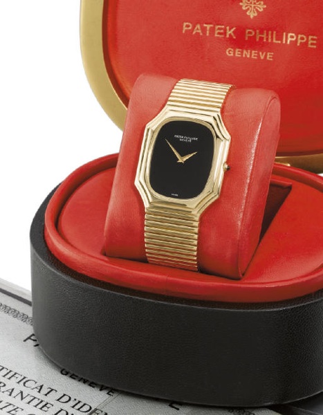 Patek Philippe. An unusual 18K gold rectangular-shaped wristwatch with onyx dial, bracelet, original certificate and box