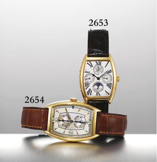 FRANCK MULLER. AN 18K GOLD TONNEAU-SHAPED AUTOMATIC TRIPLE TIME ZONE WRISTWATCH WITH CENTRE SECONDS AND DATE