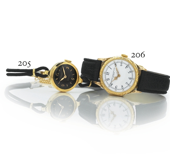 PATEK PHILIPPE. A LADY'S 18K GOLD WRISTWATCH WITH BLACK DIAL