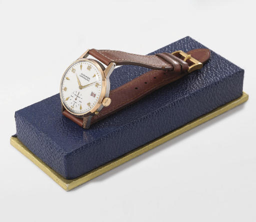 Movado. A stainless steel and pink gold wristwatch with date