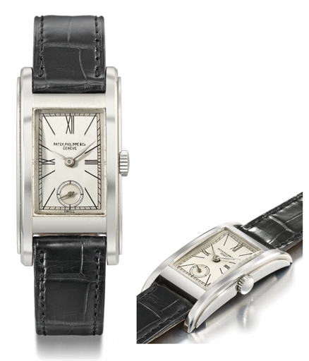Patek Philippe. A highly rare and unusual stainless steel rectangular curved wristwatch with two-tone silvered dial