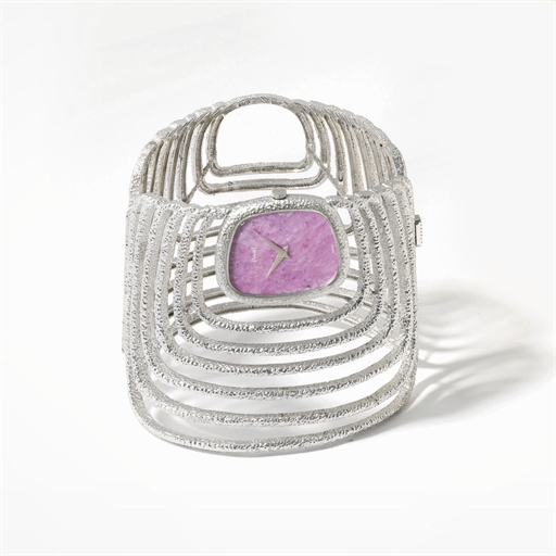 Piaget. A highly rare and unusual 18K white gold bangle wristwatch with red hardstone dial