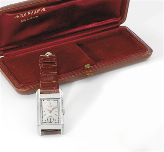 Patek Philippe. A fine and rare stainless steel rectangular curved wristwatch with box