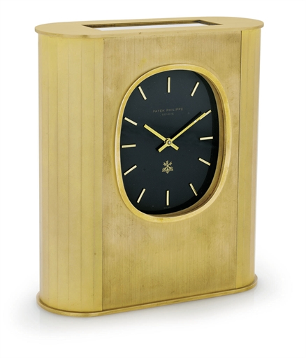 PATEK PHILIPPE. A GILT-BRASS SOLAR-POWERED MANTEL CLOCK