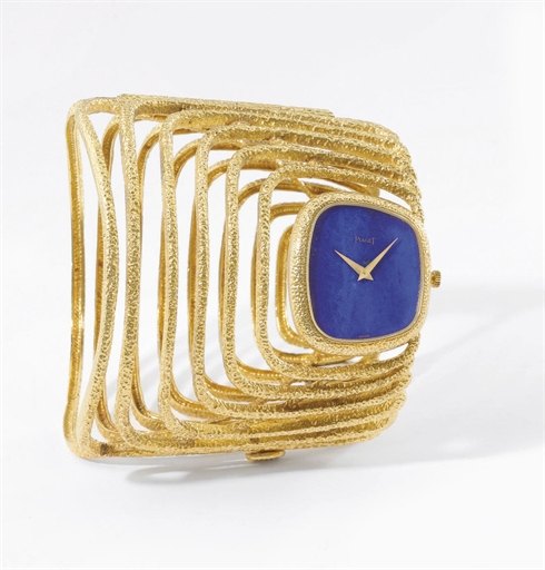 Piaget. A highly rare and unusual 18K gold bangle wristwatch with lapis lazuli dial and box