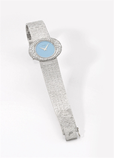 Piaget. A lady's fine 18K white gold and diamond-set oval wristwatch with turquoise dial and bracelet
