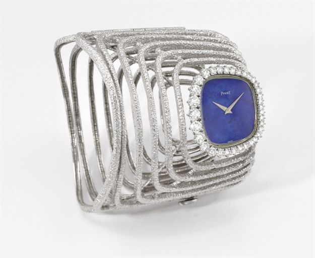 Piaget. A highly rare and unusual 18K white gold and diamond-set bangle wristwatch with lapis lazuli dial