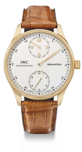 IWC. A fine and large 18K pink gold wristwatch with regulator dial