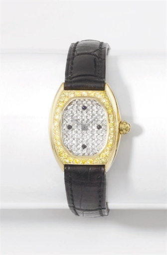 Gerald Genta. A lady's fine 18K gold, diamond and sapphire-set oval wristwatch