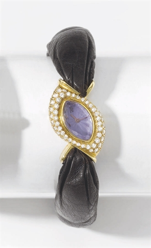 Audemars Piguet. A lady's elegant and unusual 18K gold, diamond and amethyst-set eye-shaped wristwatch