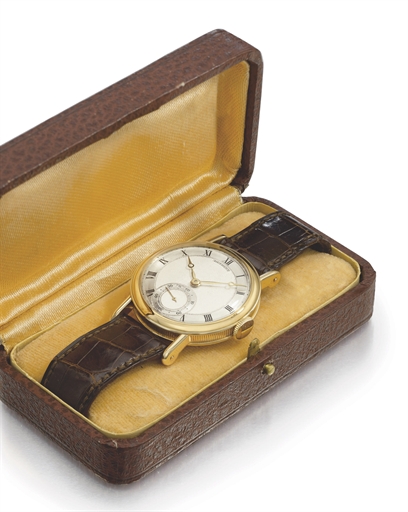 Breguet. A fine and attractive 18K gold wristwatch