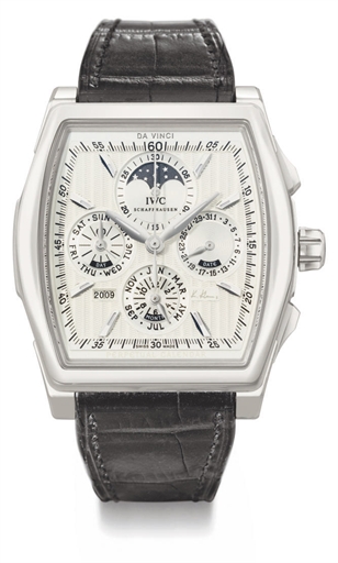 IWC. A fine, rare and large platinum tonneau-shaped automatic limited edition perpetual calendar chronograph wristwatch with moon phases