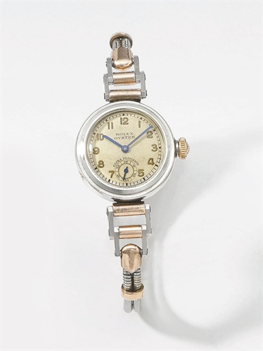 Rolex. A lady's unusual stainless steel and 9K pink gold wristwatch with flexible lugs, bracelet and box