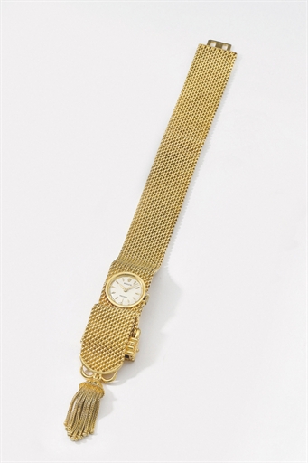 Rolex. A lady's unusual 18K gold bracelet watch with box