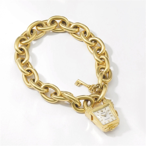 Rolex. An unusual 18K gold padlock-form bracelet watch