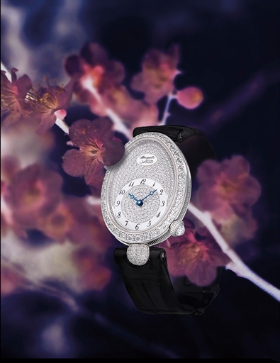 BREGUET, REINE DE NAPLES.LADY'S WHITE GOLD AND DIAMOND-SET AUTOMATIC WRISTWATCH WITH DIAMOND-SET AND MOTHER-OF-PEARL DIAL