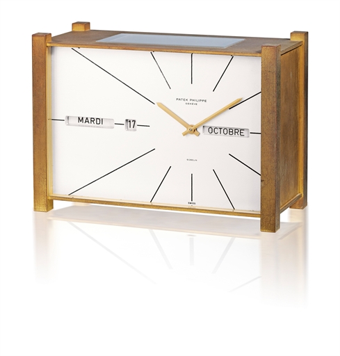 PATEK PHILIPPE, REF. 503.RARE GILT BRASS RECTANGULAR SOLAR POWERED TRIPLE CALENDAR TABLE CLOCK