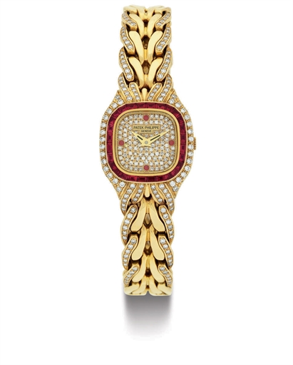 PATEK PHILIPPE. A LADY'S FINE 18K GOLD, DIAMOND AND RUBY BRACELET WATCH