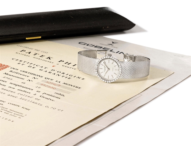 Patek Philippe. A ladies fine 18K white gold and diamond-set wristwatch with bracelet, original certificate, retailer's invoice and box
