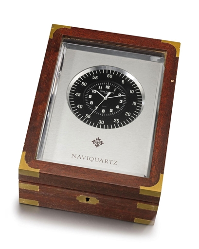 Patek Philippe. An aluminium electronic marine chronometer with sweep centre seconds, Naviquartz brochure and original mahogany box