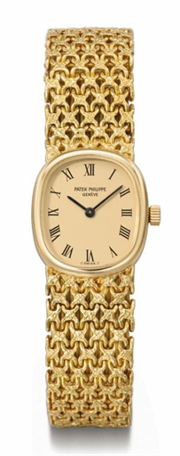 Patek Philippe. A lady's 18K gold oval wristwatch with bracelet and Certificate of Origin
