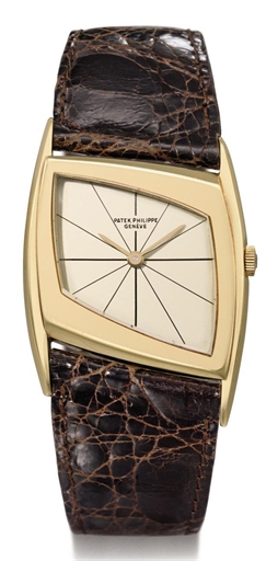 Patek Philippe. A fine and rare 18K gold asymmetrical wristwatch, designed by Gilbert Albert, with box