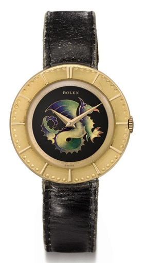 Rolex. An extremely fine, rare and attractive 18K gold wristwatch with cloisonn