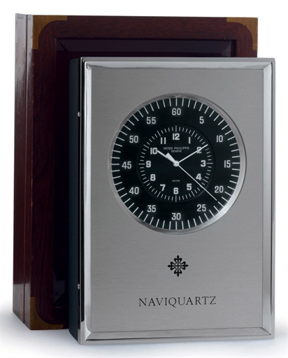 PATEK PHILIPPE. AN ALUMINIUM ELECTRONIC DESK CLOCK WITH CENTER SECONDS