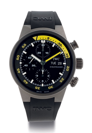 IWC. A TITANIUM AUTOMATIC CHRONOGRAPH WRISTWATCH WITH DAY AND DATE