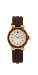 AN 18K GOLD WATER RESISTANT WRISTWATCH WITH DATE, BY KORLOFF