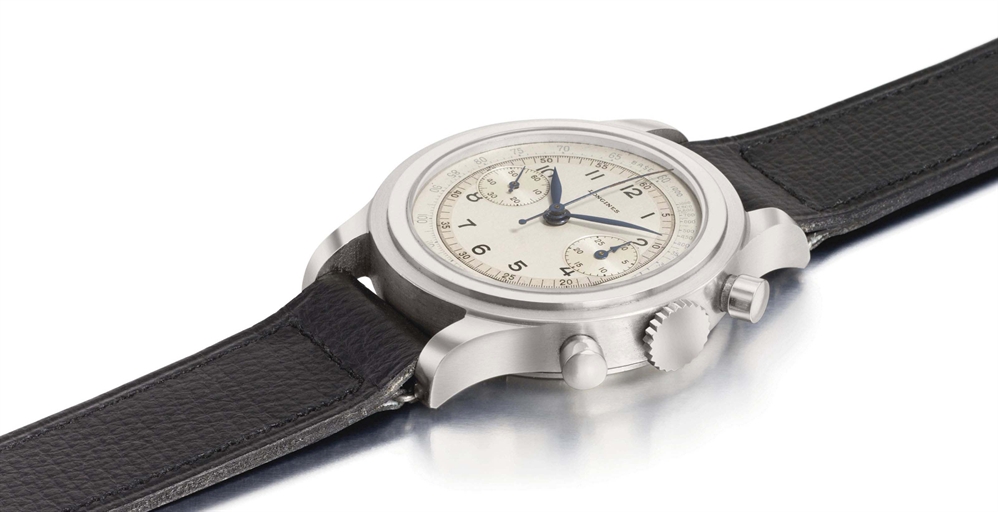 Longines. A large and rare stainless steel chronograph wristwatch with two-tone silvered dial, original metal price tag and box