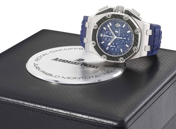 Audemars Piguet. A large and heavy platinum limited edition automatic chronograph wristwatch with date and carbon fibre inserts