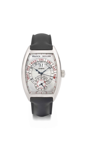 FRANCK MULLER. A LARGE 18K WHITE GOLD TONNEAU-SHAPED CURVED AUTOMATIC WRISTWATCH WITH RETROGRADE DAY, LARGE DATE AND MONTH