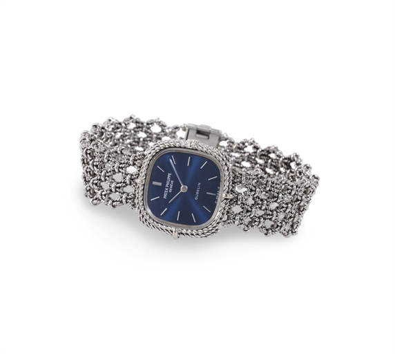 PATEK PHILIPPE. A LADY'S 18K WHITE GOLD CUSHION BRACELET WATCH