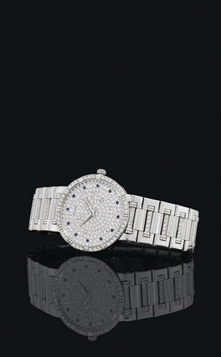 PIAGET. AN 18K WHITE GOLD, DIAMOND AND SAPPHIRE-SET WRISTWATCH WITH BRACELET