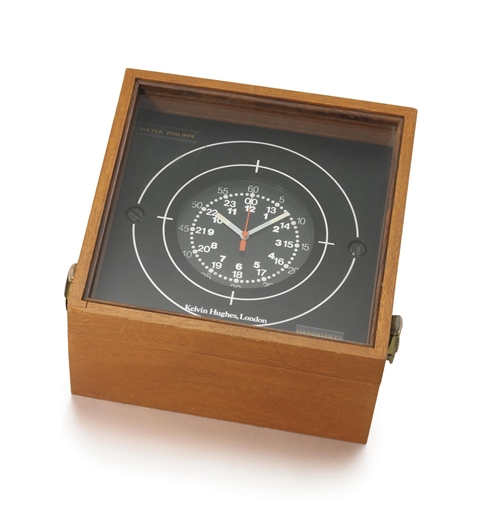 Patek Philippe. An unusual metal and aluminium square electronic marine chronometer with sweep centre seconds and wooden box
