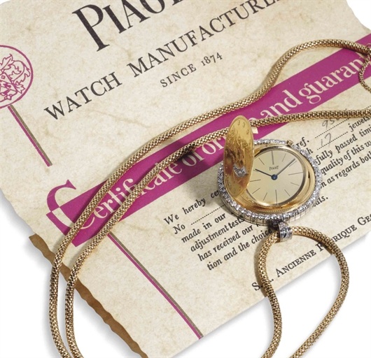 Piaget. A Fine 18k Gold Platinum And Diamond Coin Watch With Chain