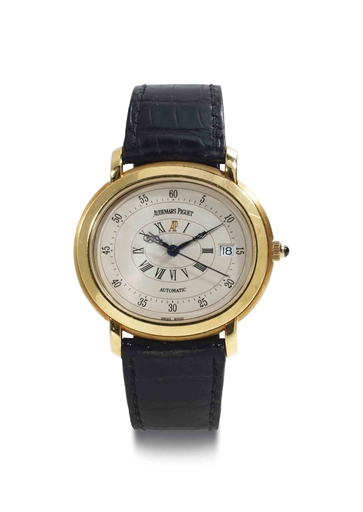 Audemars Piguet. An 18k Gold Oval Automatic Wristwatch With Date And Center Seconds