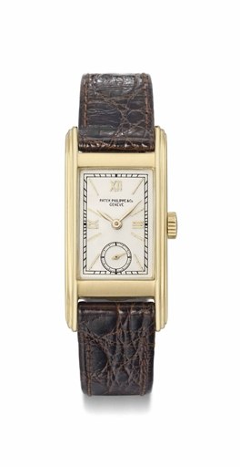 Patek Philippe. A fine and rare 18K gold elongated rectangular curved wristwatch