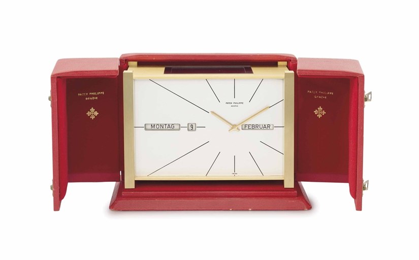 Patek Philippe. A very fine and rare gilt brass rectangular solar-powered perpetual calendar desk clock with box