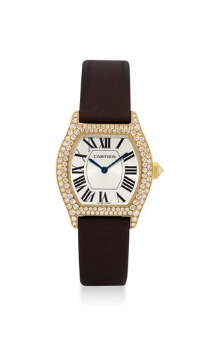 CARTIER. A LADY'S FINE 18K GOLD AND DIAMOND-SET TONNEAU-SHAPED WRISTWATCH