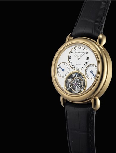 AUDEMARS PIGUET. A FINE 18K GOLD TOURBILLON AUTOMATIC WRISTWATCH WITH POWER RESERVE AND DATE