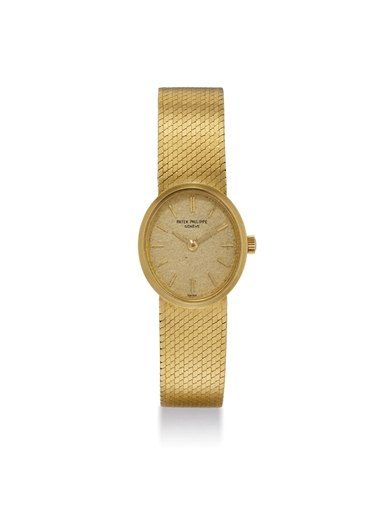 PATEK PHILIPPE. A LADY'S 18K GOLD OVAL BRACELET WRISTWATCH